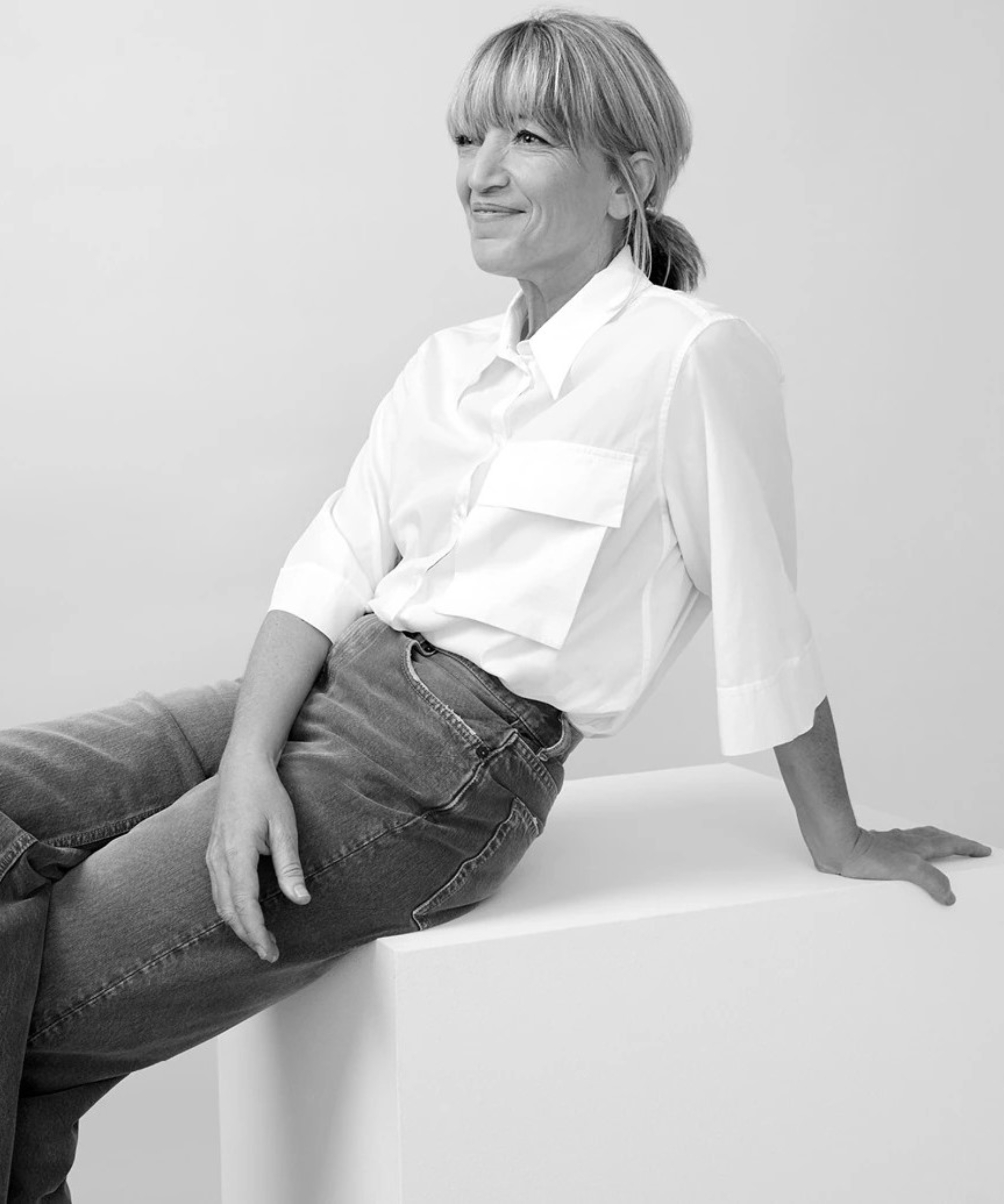 black and white image of female with blond hair in ponytail