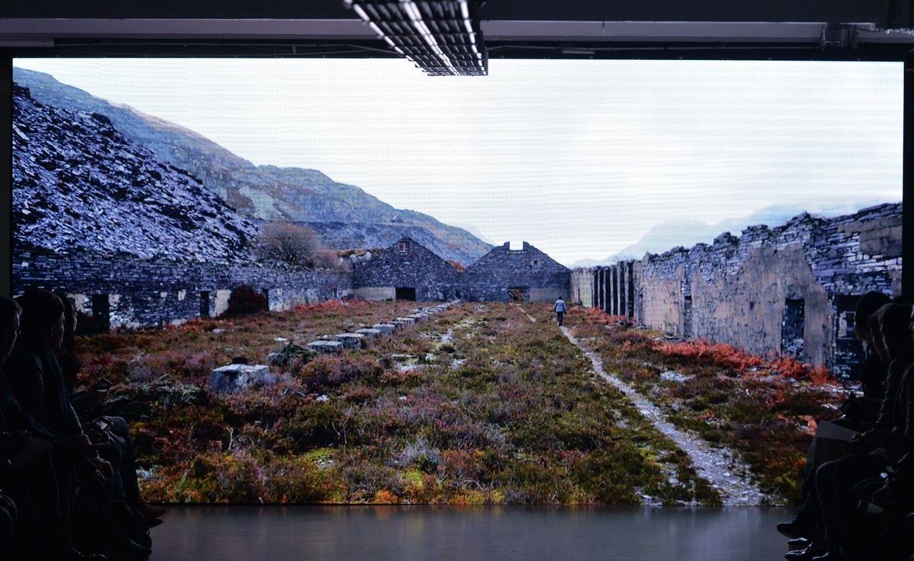 Screen showing dizzying highland vistas and mountain in the background