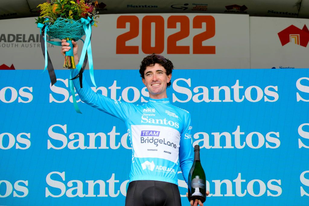 WOODSIDE AUSTRALIA JANUARY 28 James Whelan of Australia and Team Bridgelane celebrates winning the Blue Santos Leaders Jersey on the podium ceremony after the 2nd Santos Festival Of Cycling 2022 Mens Elite Stage 2 a 1129km stage from Mount Lofty to Onkaparinga Valley Road Woodside TourDownUnder on January 28 2022 in Woodside Australia Photo by Daniel KaliszGetty Images