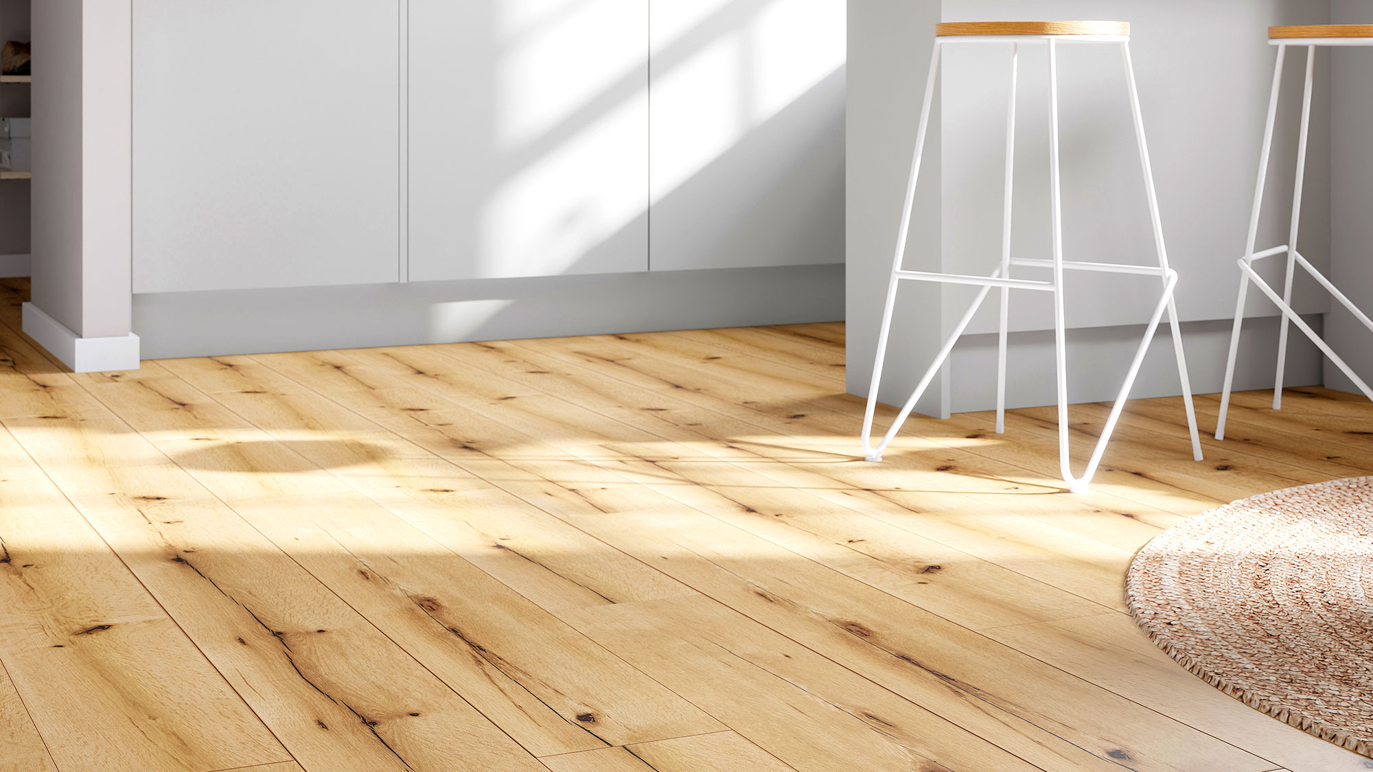 Light wood effect vinyl planks in a white kitchen with contemporary tall stools and a rug in shot