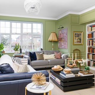 green living room with grey leather sofas