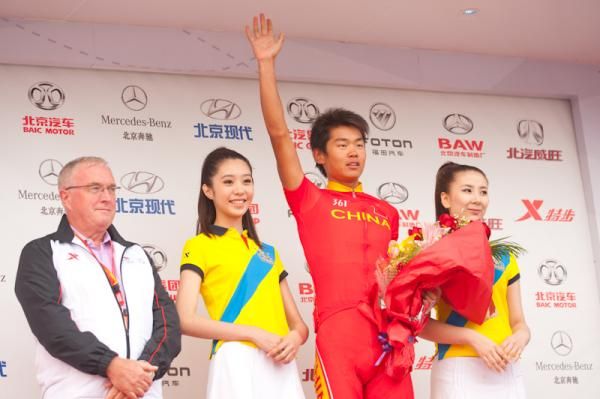 Chinese rider Wang Meiyin on the podium after his day's efforts.
