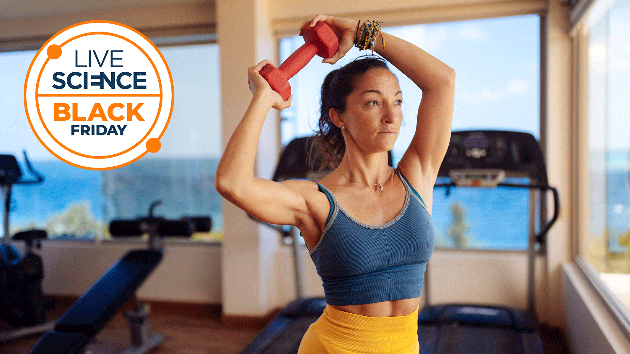A Live Science Black Friday deals logo and a picture of a young woman exercising in her home gym 