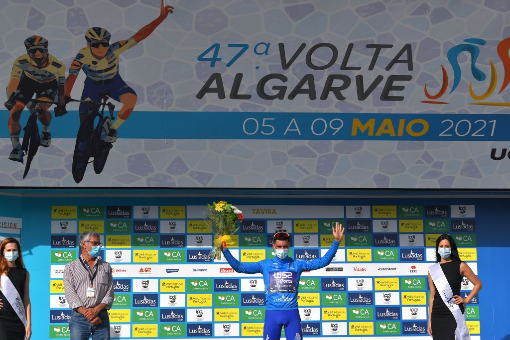 TAVIRA PORTUGAL MAY 07 Joo Rodrigues of Portugal and Team W52Fc Porto Blue Mountain Jersey celebrates at podium during the 47th Volta Ao Algarve 2021 Stage 3 a 2031km stage from Faro to Tavira Mask Covid Safety Measures Miss Hostess VoltAlgarve VAlgarve2021 on May 07 2021 in Tavira Portugal Photo by Luc ClaessenGetty Images