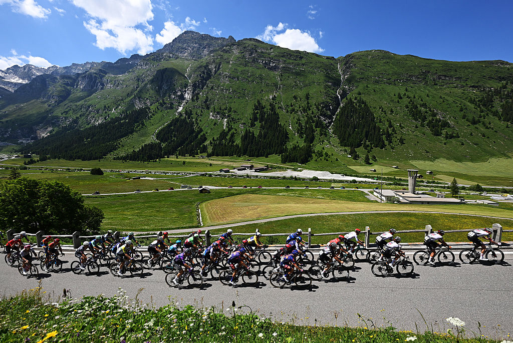 SANTA MARIA IN CALANCA, SWITZERLAND - JUNE 19: A general view of Romain Gregoire of France and Team Groupama - FDJ and the peloton compete climbing to the Passo San Bernardino (1615m) during the 88th Tour de Suisse, Stage 5 a 183.8km stage from La Punt to Santa Maria in Calanca 941m / #UCIWT / on June 19, 2025 in Santa Maria in Calanca, Switzerland. (Photo by Tim de Waele/Getty Images)