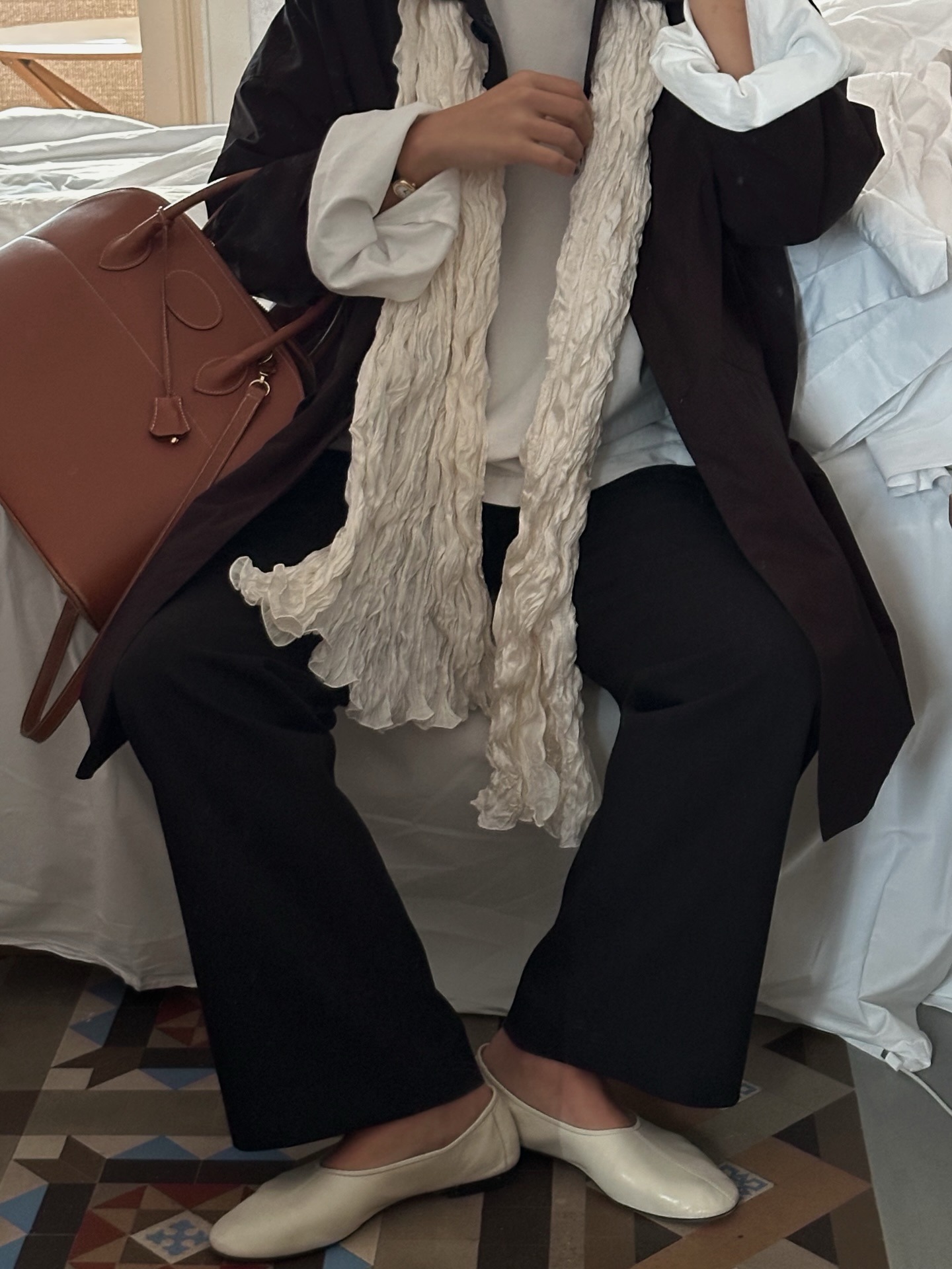 Woman in black pants and high-vamp pumps.