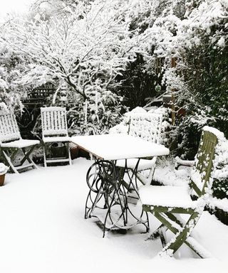 Snow and ice on a patio in a garden