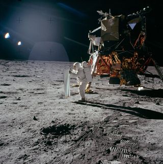 Apollo 11 astronaut Buzz Aldrin works near the lunar module, the Eagle, during the mission.