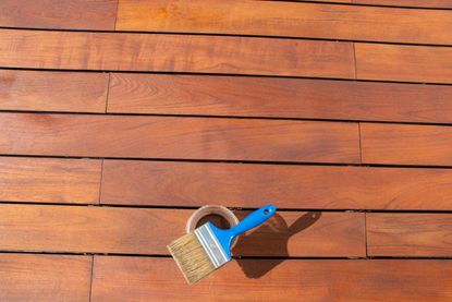 Deck stained with paint brush and stain