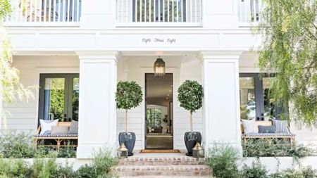 white front porch with benches