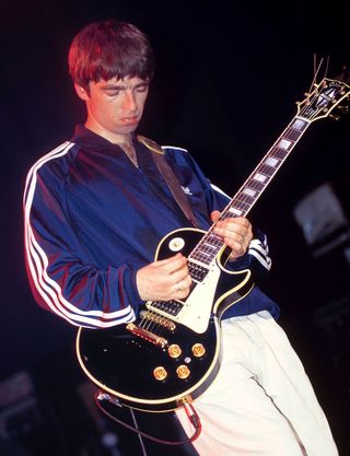Noel Gallagher plays a black Gibson Les Paul formerly owned by Johnny Marr