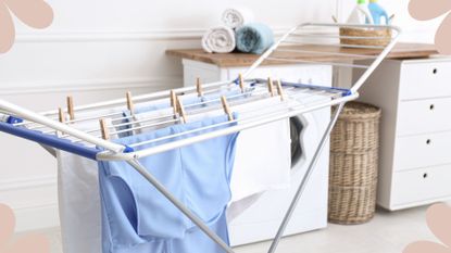 Clothes airer with clothes in a laundry room to show how to dry clothes indoors in winter