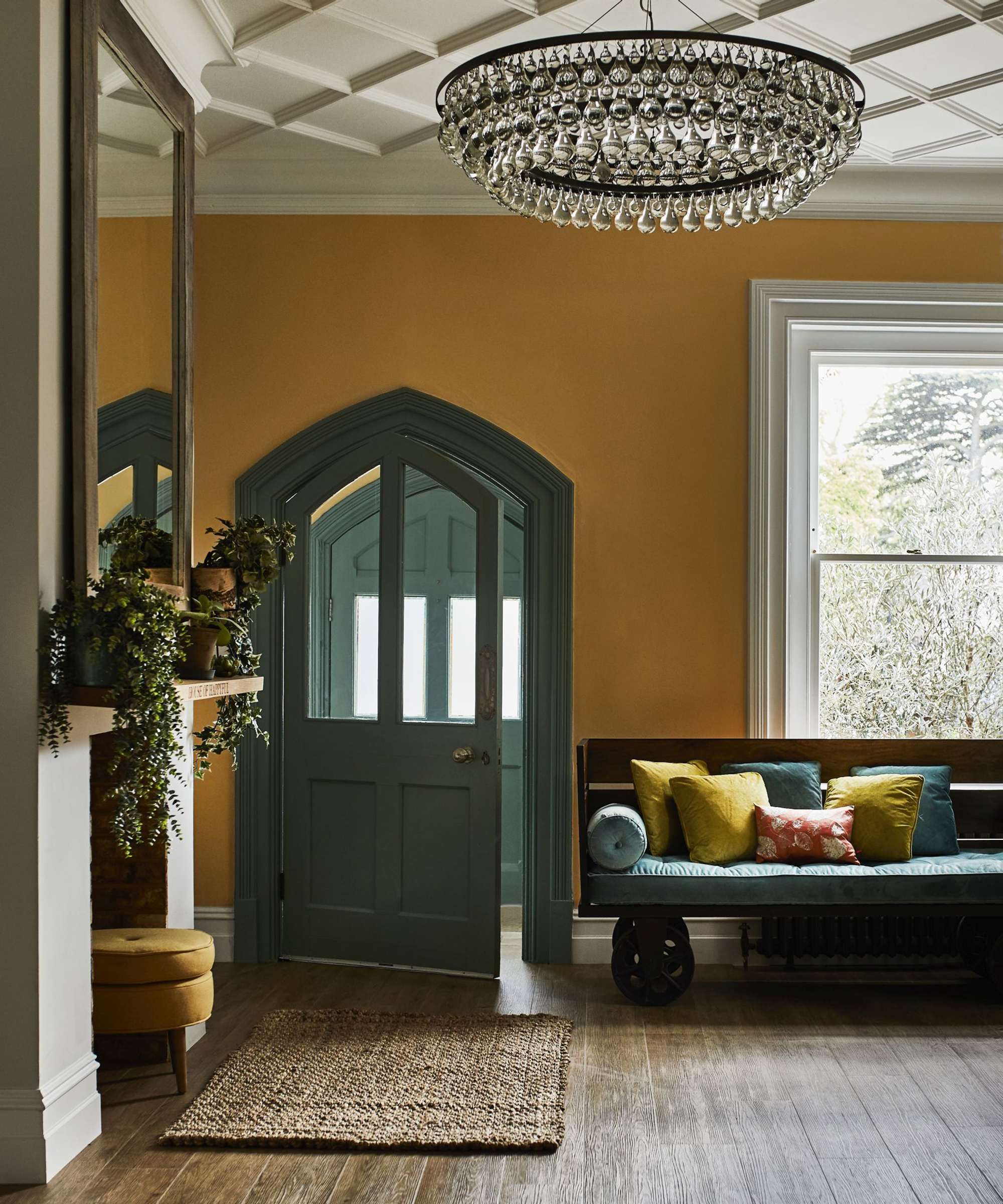 Hallway ideas by Carpetright with seating area and statement chandelier