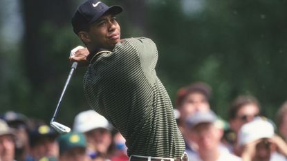 Tiger Woods plays a tee shot during the third round of the 1997 Masters