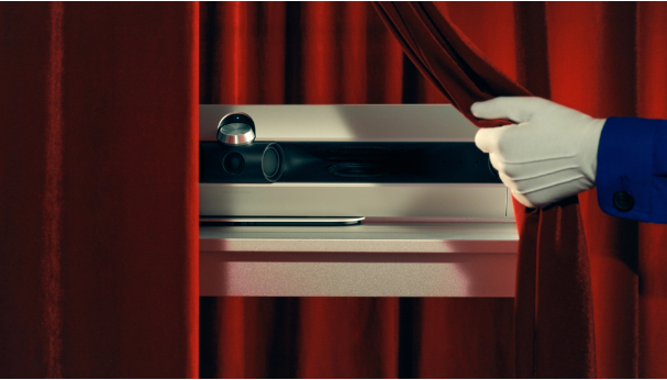 Bang &amp; Olufsen Beosound Premiere being revealed by a mysterious gloved hand.