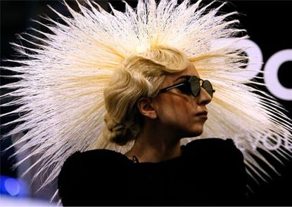 Lady Gaga debuts bizarre hair hat at Polaroid launch