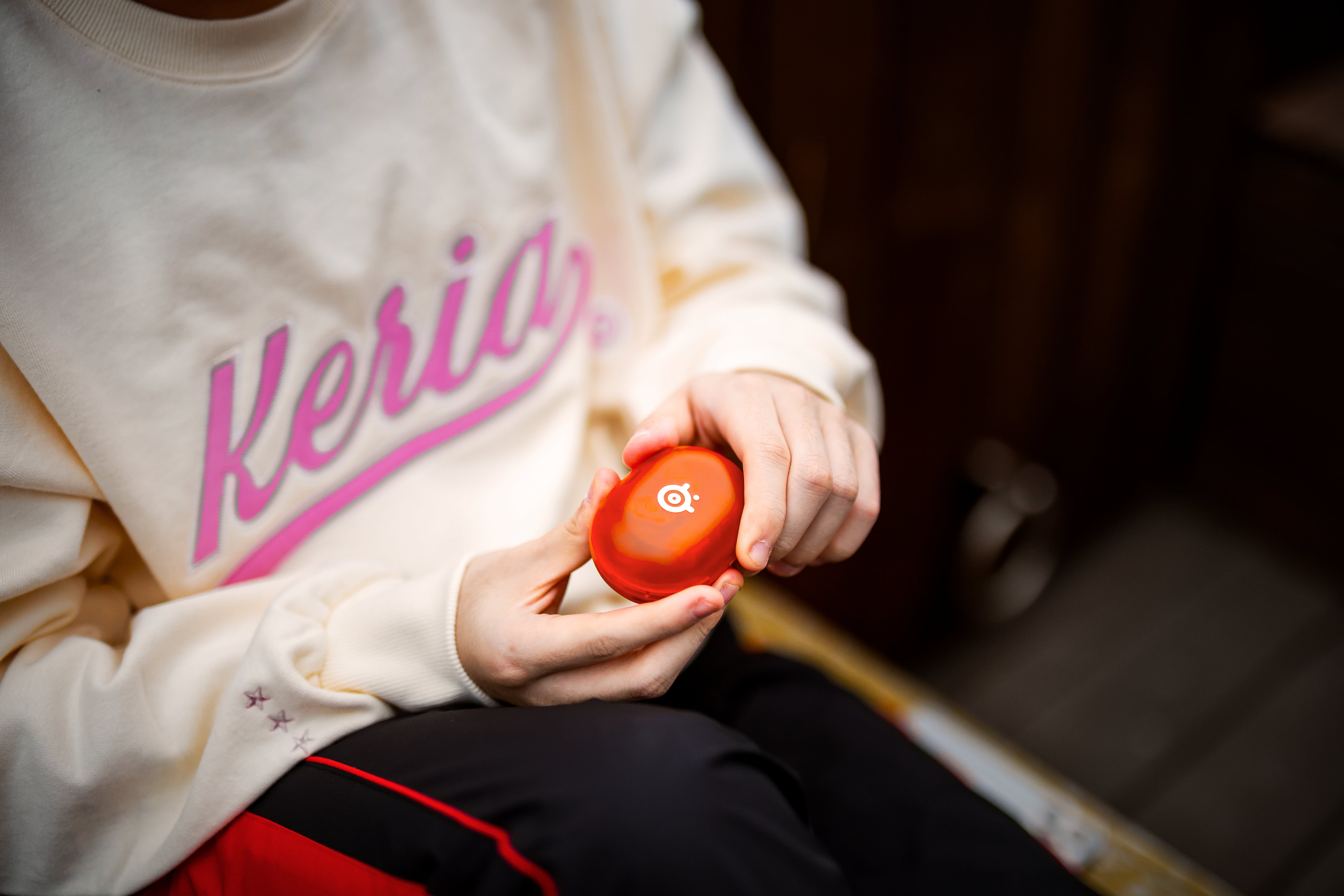 A lifestyle shot of the Glorange SteelSeries Arctis Gamebuds.
