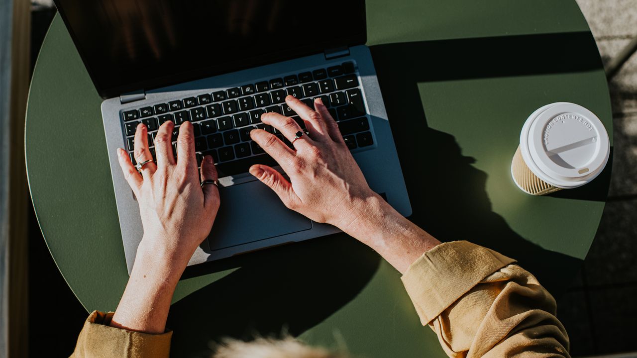 Hands typing on a computer. 