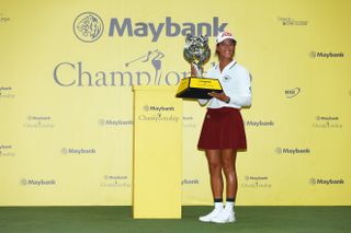 Celine Boutier holds the Maybank Championship trophy