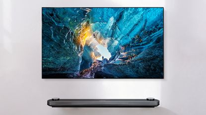 LG Wallpaper OLED TV mounted on wall with soundbar underneath