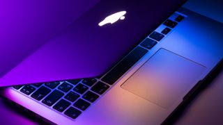 Apple MacBook Pro under colorful lighting