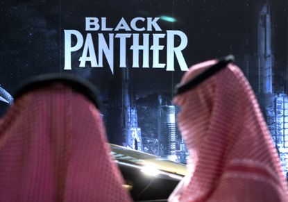 Saudi Arabians wait to watch "Black Panther."