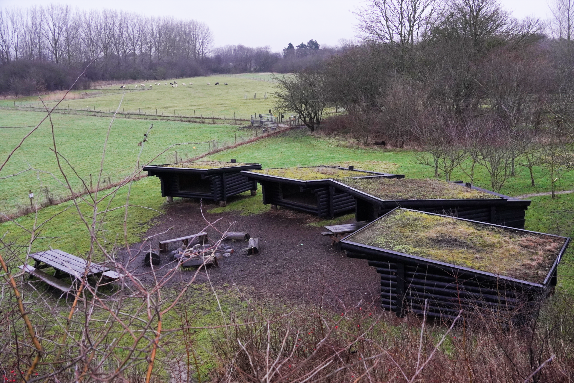 Image shows the a set of bikepacking huts in Denmark