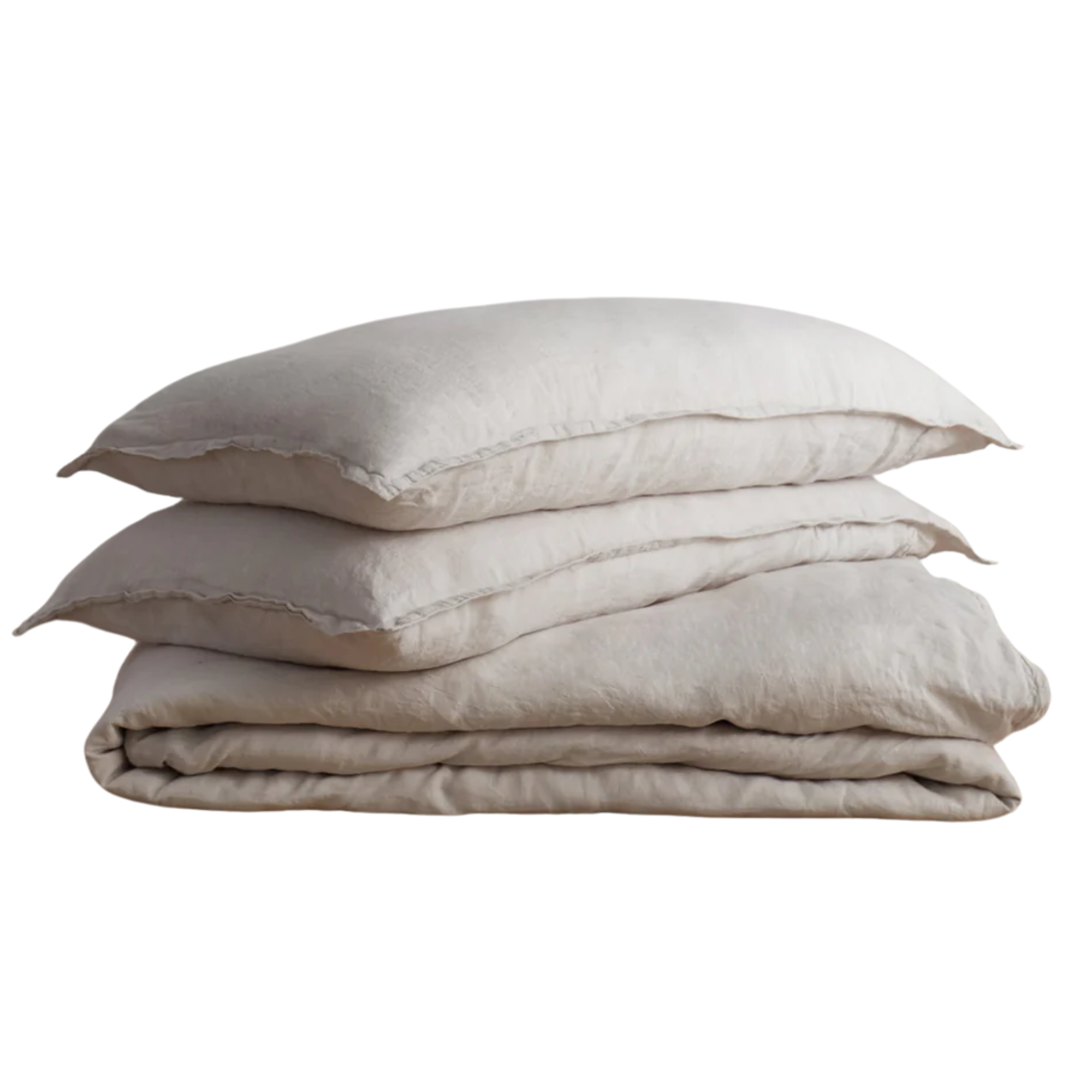 two pillows and a duvet cover in a light ivory color