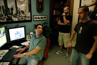 Andrew Gordon (left) talks to two animators in his office at Pixar