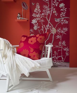 Red painted bedroom with scarlet accessories