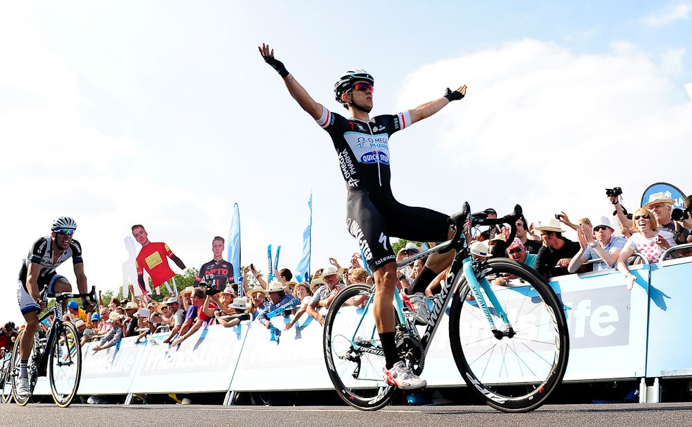 Michal Kwiatkowski (r) of Poland and Omega Pharma-QuikStep celebrates as he crosses the line to win during Stage Four of the 2014 Tour of Britain from Worcester to Bristol.