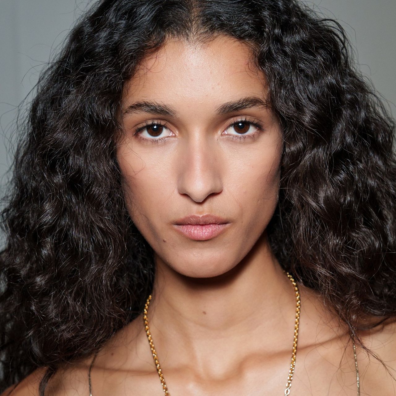 A model with glowing skin after using toner.