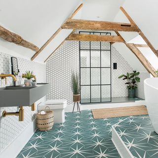 bathroom with white hexagon designed wall grey wash basin wooden beams on wall designed flooring