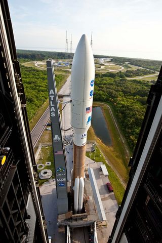 Atlas 5 rocket bearing Juno spacecraft begins rolling to the launch pad