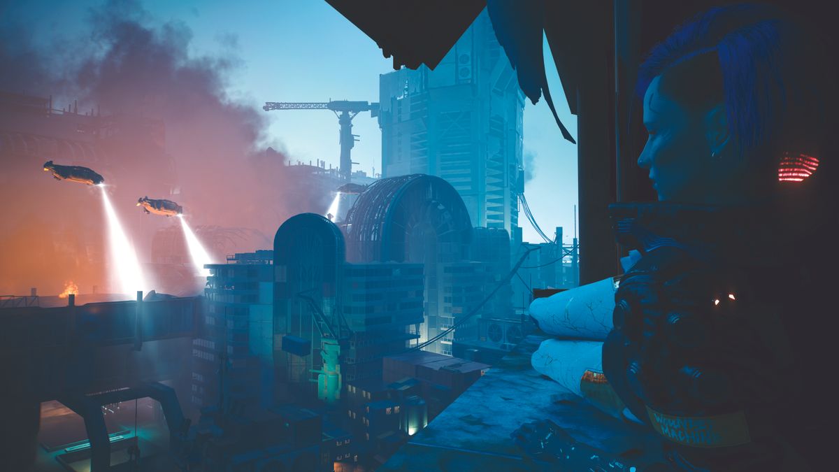 V looking out over the city where there is a fire in the distance
