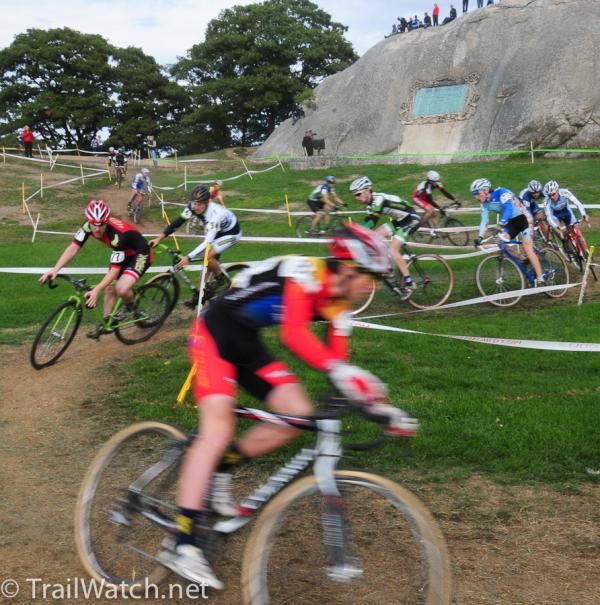 Riders zig zag the flat grass field