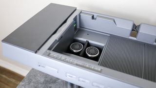 An overhead shot of the inside of the Hexcal Studio's cord storage chamber showing the extra feet and USB bridging ports