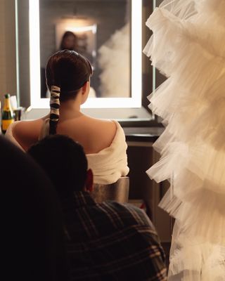 Devery Jacobs gets ready for the 2024 Emmys with her tulle suit and her ponytail visible