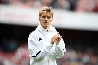 Martin Odegaard of Arsenal applauds the fans following the Premier League match between Arsenal FC and Brighton &amp; Hove Albion FC at Emirates Stadium on August 31, 2024 in London, England.