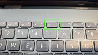 close-up of a keyboard with the Function key for increasing screen brightness highlighted