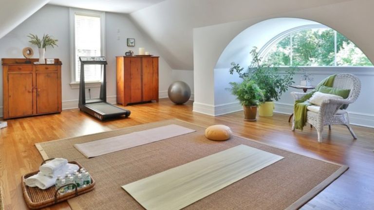 A home gym area in an attic room of a traditional home