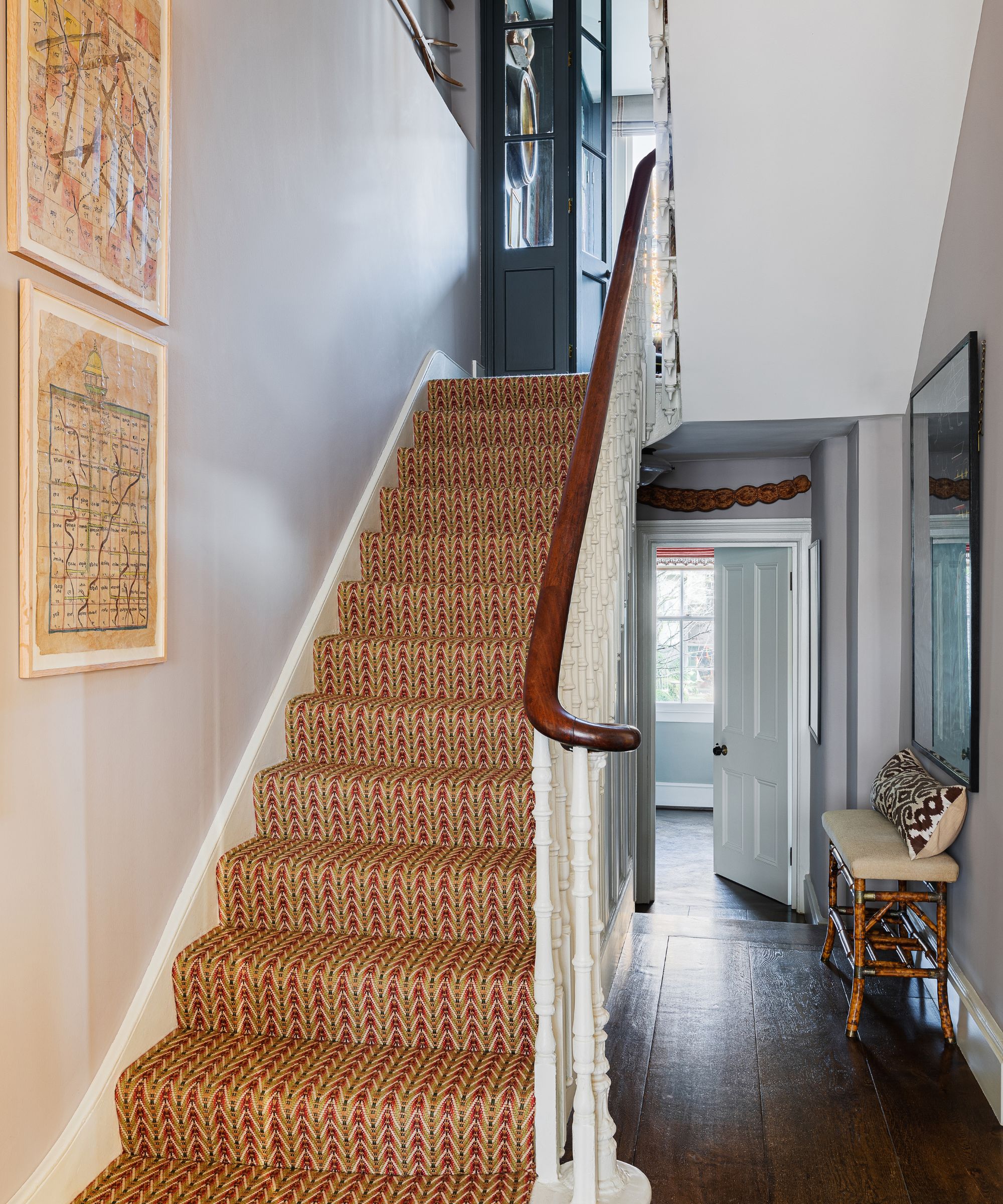 A flight of stairs with a patterned carpet