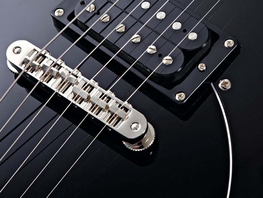 The bridge has similar string spacing to PRS's Stop-Tail wrapover bridge.