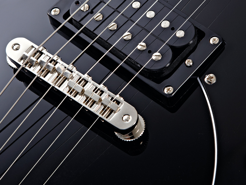 The bridge has similar string spacing to PRS's Stop-Tail wrapover bridge.