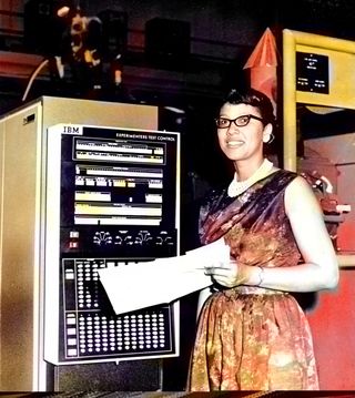 A digitally colorized photo of Melba Roy Mouton standing next to a large computer at NASA headquarters in 1964