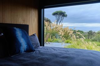 Looking out from bedroom to nature at New Zealand house