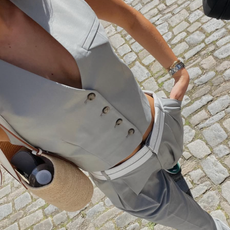 woman wearing matching set vest and pants