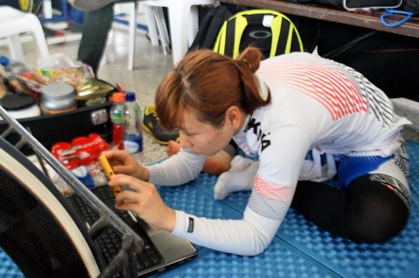 A Korean rider analyzing data.