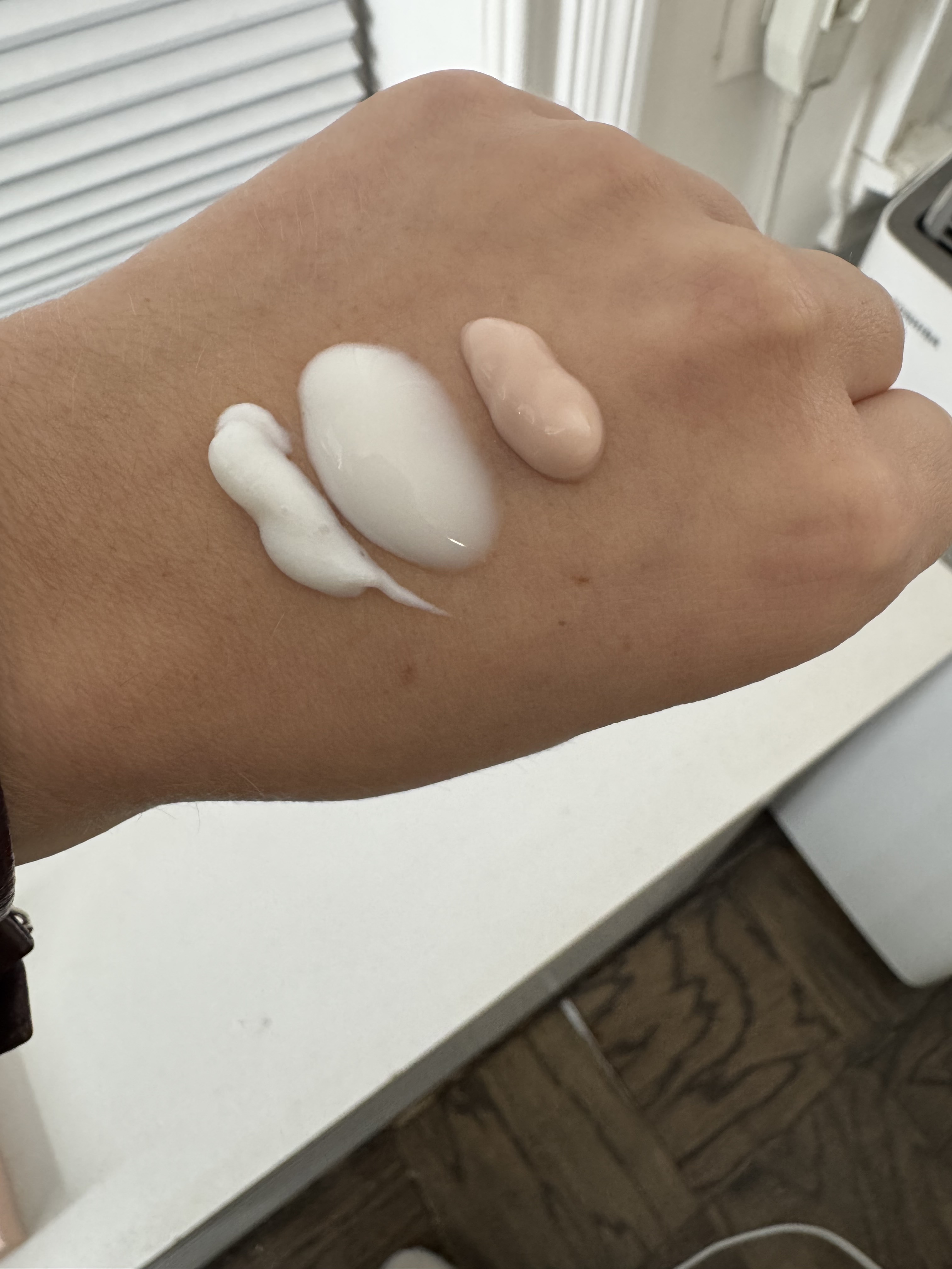 hand with product swatches on it