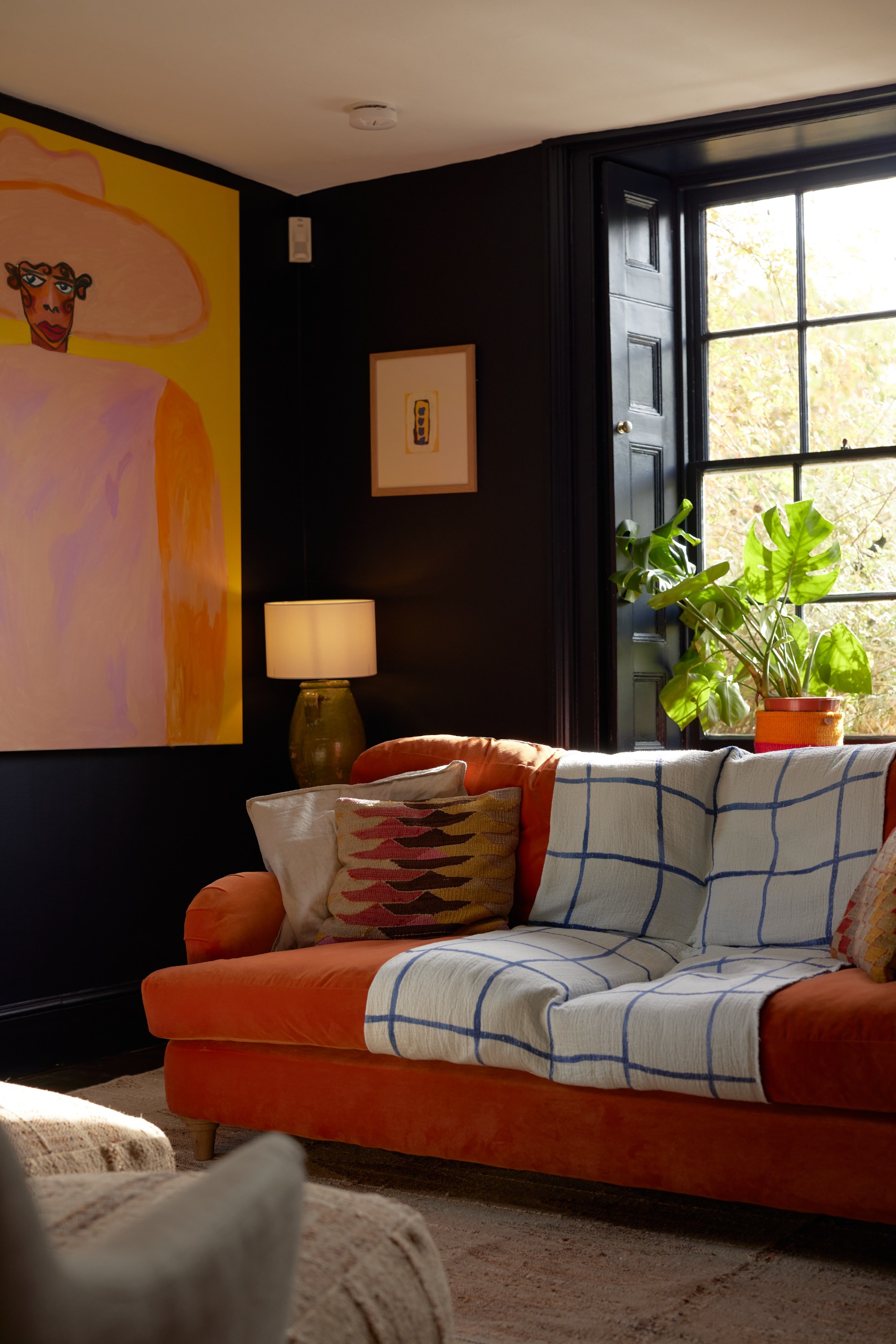 Restored red brick farmhouse with jewel-tone interiors